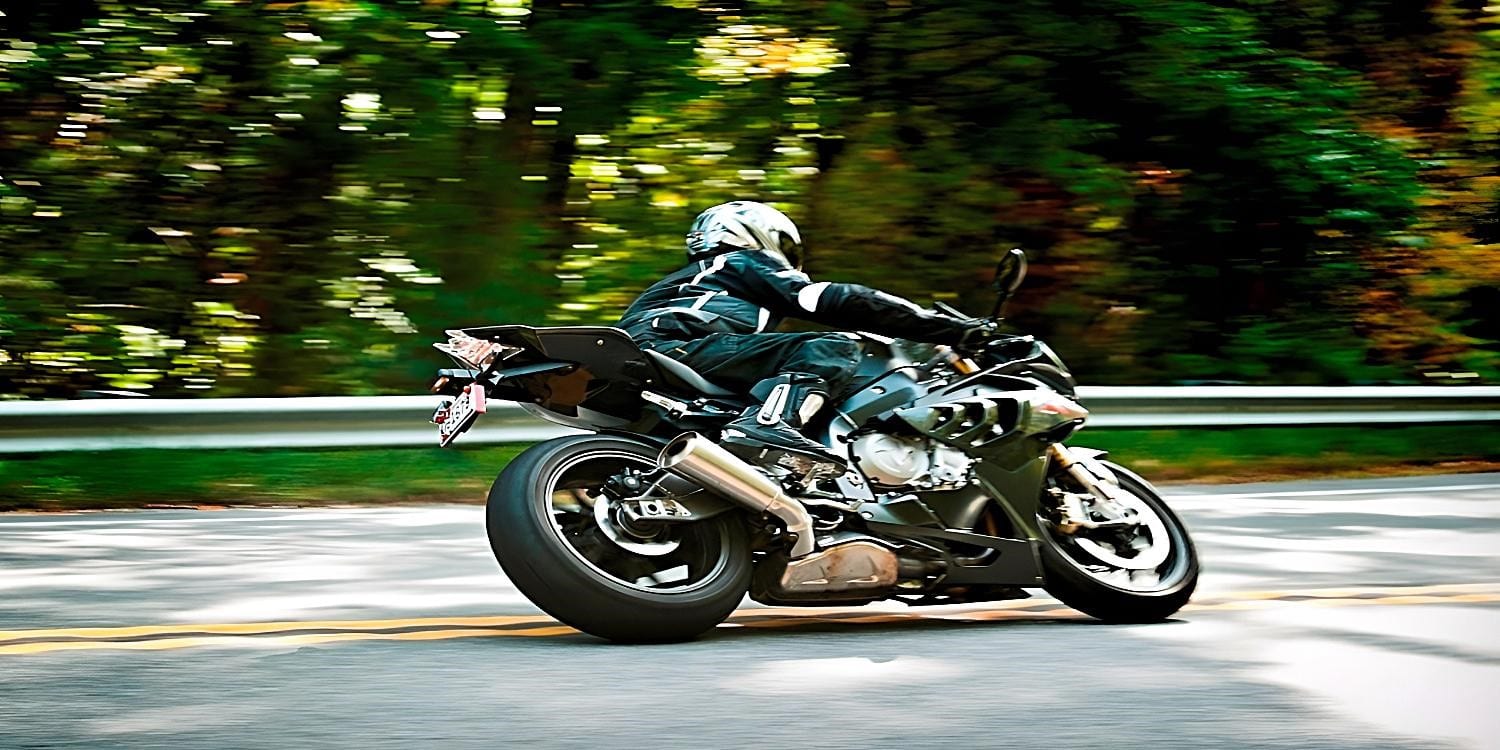 Michael Parrotte at it again on the BMW S 1000 RR doing his thing around a curve just next to the yellow line on the smooth Cherohala Skyway. If you are up for some pristine solitude, try the Cherohala Skyway route for some twisties and pristine mountain scenery. But there are no service points along the Smoky Mountains route. You will need to prepare adequately for the weather and bring as much fuel as you need for your torque generator to last you the 32 miles of pure niceness. And remember, at highway speeds, traction is everything. Takeoff, handling, braking, and getting to your destination safely. Painted parts of the road are ice slick when wet and will not give you the friction you need.