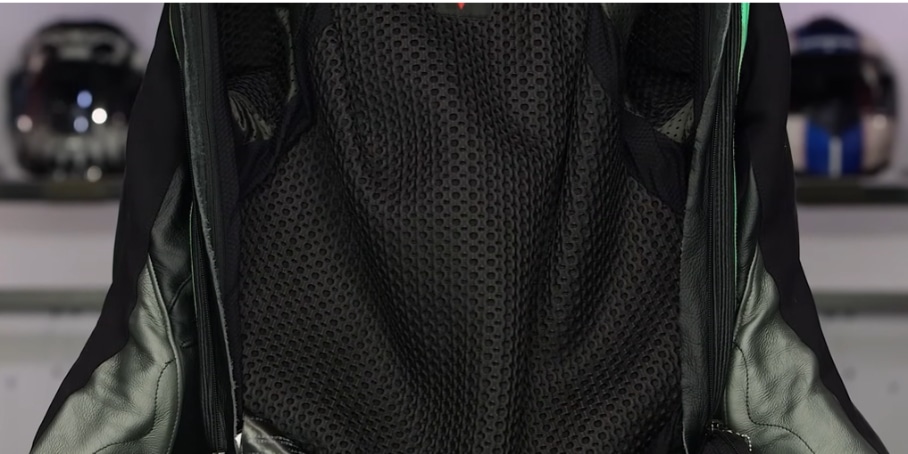 The inside of the black leather motorcycle suit showing a mesh lining.