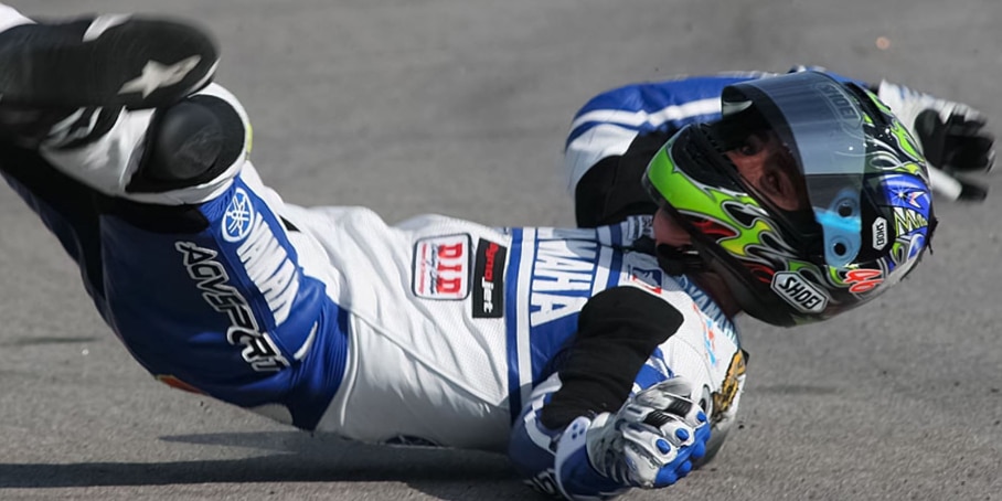 Josh Herrin, rider number 46 and MotoAmerica Supersport Champion, falls on his back after a highside collision, showcasing the importance of racing suit armor. But frequent falls can diminish its effectiveness.