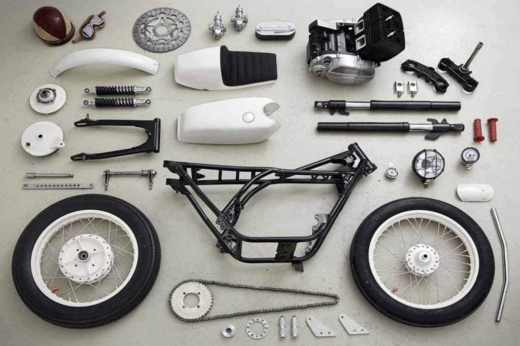 Parts for a cafe racer build, starting with the frame then choosing which accessories to mount on the bike. Here, we are missing an exhaust, a bucket load of bolts and the cabling to flow life through it. Luckily, cafe racers keep it on the bare minimums and parts are relatively inexpensive.