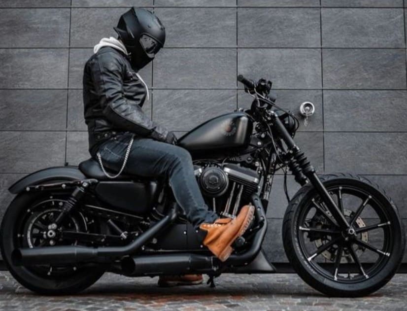 A rider shows off his custom Harley Davidson Street Bob 114 with the vivid black color scheme. Despite the softail rear, the Street Bob is very stiff and becomes the modern iteration of the authentic street bobber of the 30s minus the unreliability issues. Unfortunately, this means it's uncomfortable for long cruises.