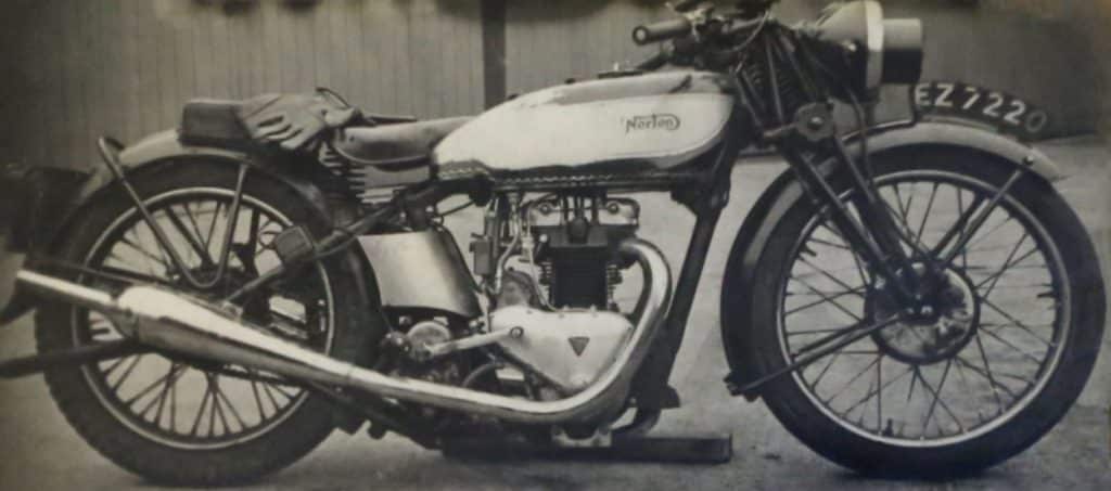 A grayscale image of the first Triton in history created in the World War II period. It is a cross between a Triumph Tiger 100's racing engine and the chassis of a Norton with international racing heritage. A headlight mask is included, which was useful in the war-time blackouts.