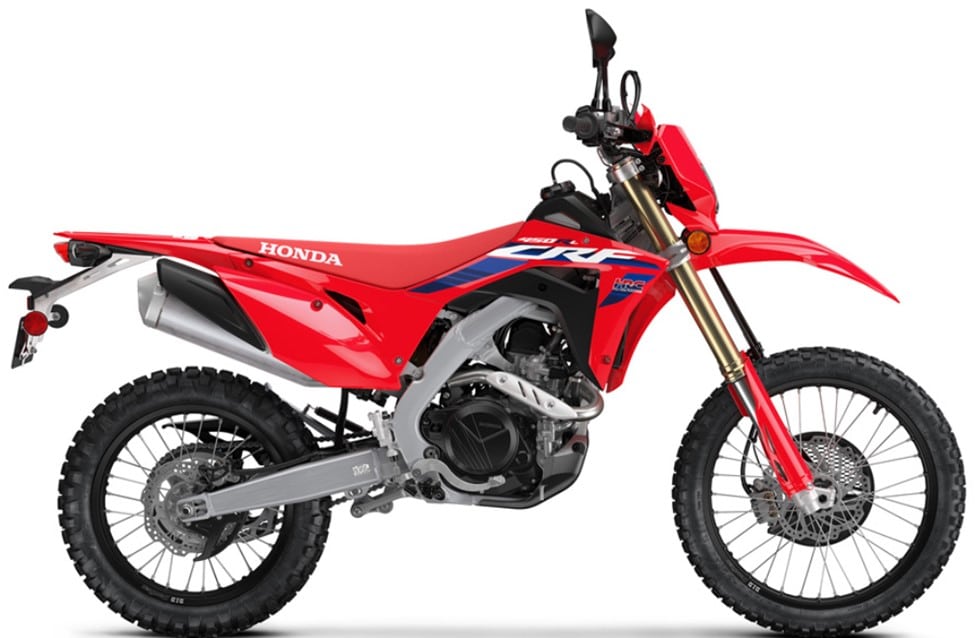 With all the hype, the 300L Rally, the smallest Red CRF in the 2024 Honda portfolio, puts on quite a show. Its rally inspired graphics are obvious and the compact build spells dual-sport fun. Honda makes them with dirt bike manners, so its long and narrow seat should allow you to ride it like one.