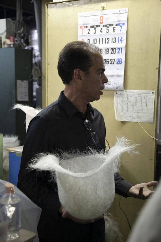 Arai Americas Managing Director, Brian Weston, oversees the preparation of a "preforma"—a bird's nest layer of finely chopped Super Fiber, primed and ready for the molding process.