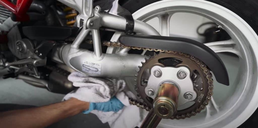 Cleaning the chain on a 2006 Ducati S2R1000 using a microfiber towel and Motul Chain cleaner to give the beast some love before the next dose of action.