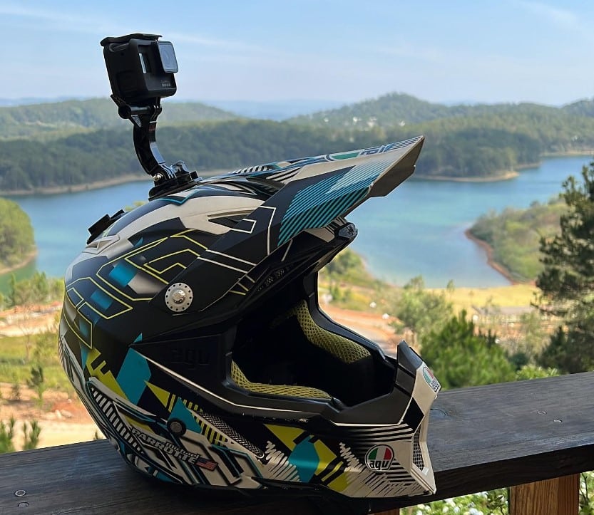 GoPro HERO8 Black top mount on the AGV AX-8 Evo helmet for a commanding view of the trails. The mount extends at least 2 inches to clear the peak, potentially causing a dragging effect on the helmet at higher speeds.