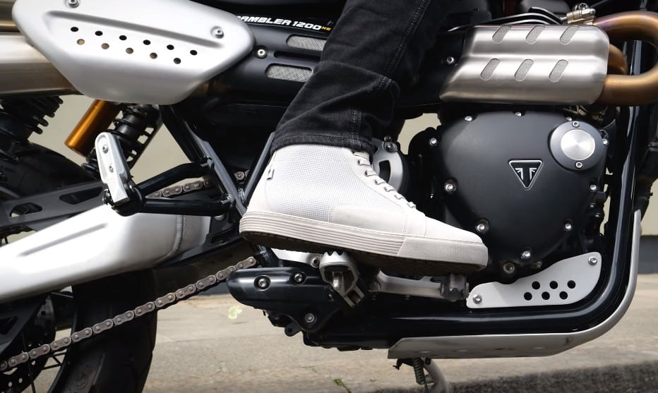 Getting accustomed to the controls on the Triumph while wearing the new John Doe Neo casual motorcycle shoes. Now you can seamlessly blend in with the crowd at the party, yet stay protected in case of a spill on your ride back home.
