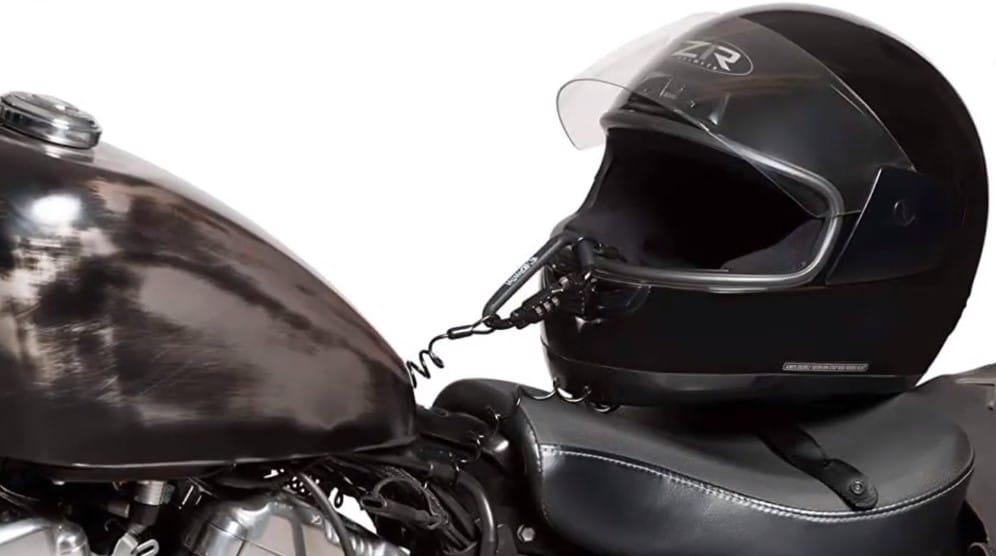 The ZR motorcycle helmet securely attached to the Yamaha V-Star 1100 Bobber’s frame using a cable-lock mechanism. The carabiner-style lock is versatile and takes up no storage extra space as you can leave it coiled on the subframe.