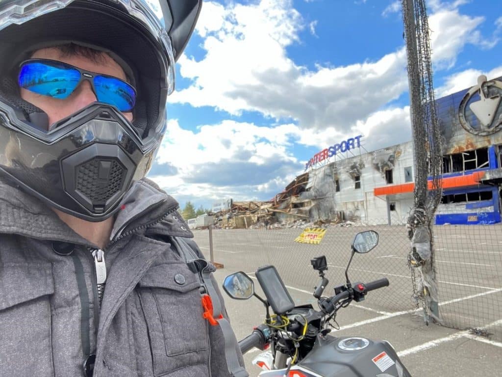 In this photo, I'm wearing the AGV AX9 Matt Carbon helmet during my trip to Bucha, Ukraine. It turned out to be the ideal choice for the cool, wet weather that the Kyiv area experienced last fall.
