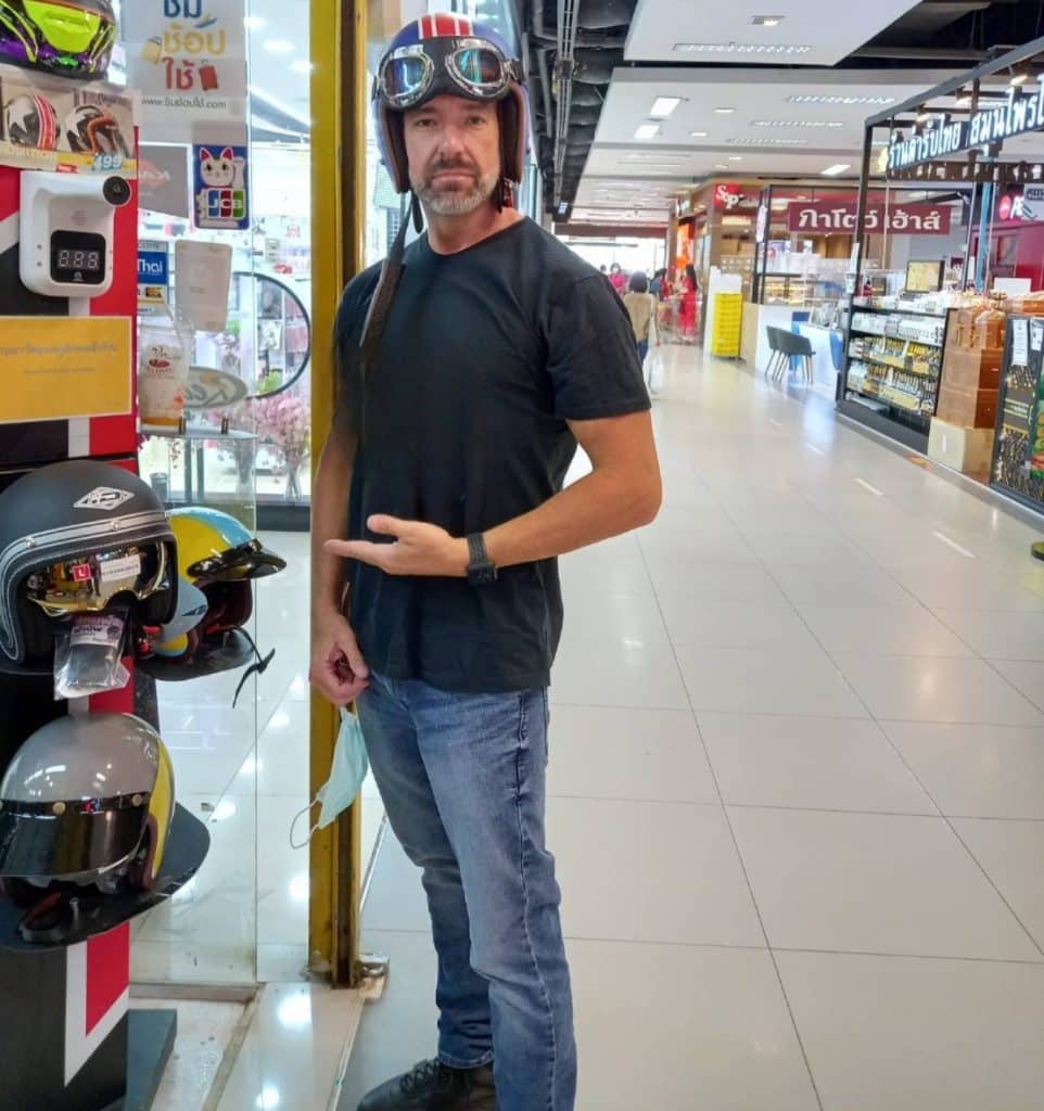 Todd in Thailand Wearing an Open Face Helmet While Out Shopping